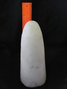 A small sugar cone, approximately 10 inches high and weighing between 3-4 pounds